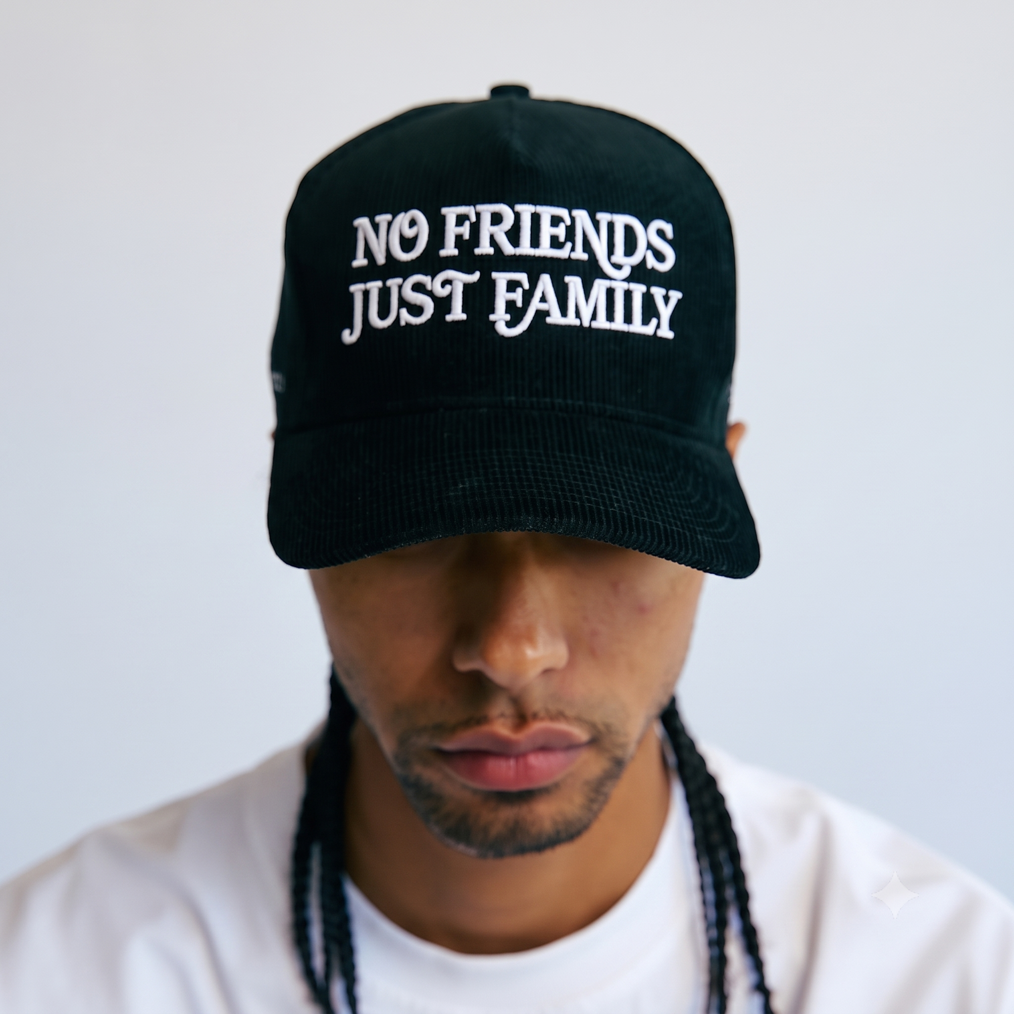 Blackout — black corduroy hat worn on model