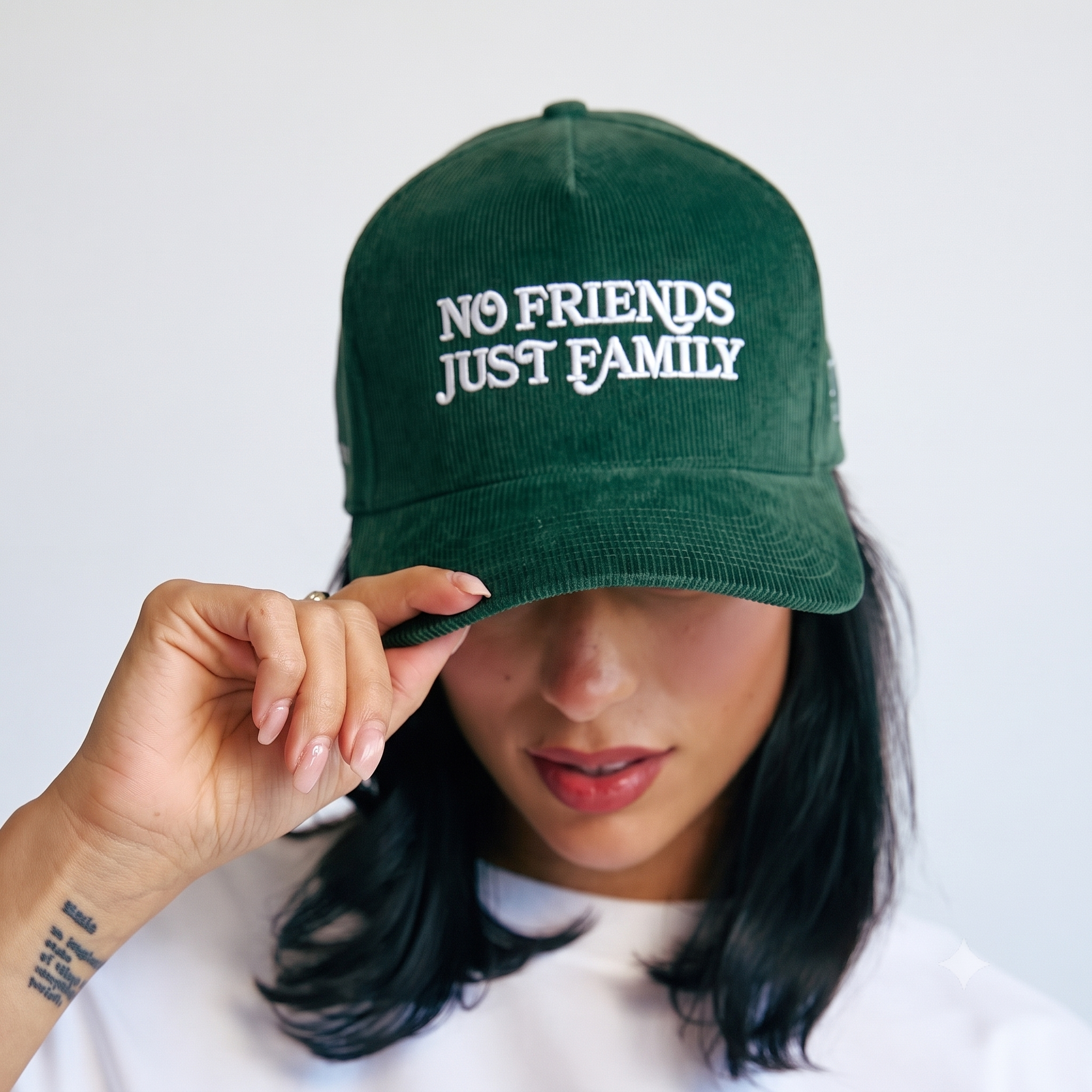 The Original — forest green corduroy hat, worn